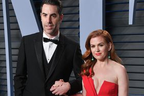 Sacha Baron Cohen (L) and Actress Isla Fisher attend the 2018 Vanity Fair Oscar Party hosted by Radhika Jones at Wallis Annenberg Center for the Performing Arts on March 4, 2018 in Beverly Hills, California