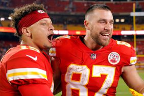 Patrick Mahomes #15 and Travis Kelce #87 of the Kansas City Chiefs celebrate after the Chiefs defeated the Las Vegas Raiders 30-29 to win the game at Arrowhead Stadium on October 10, 2022 in Kansas City, Missouri.