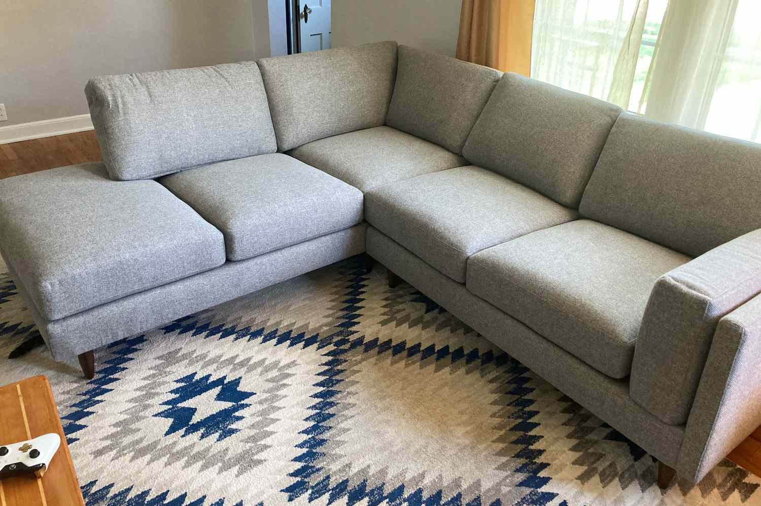 The BenchMade Modern Skinny Fat Sectional With Bumper set up in a living room
