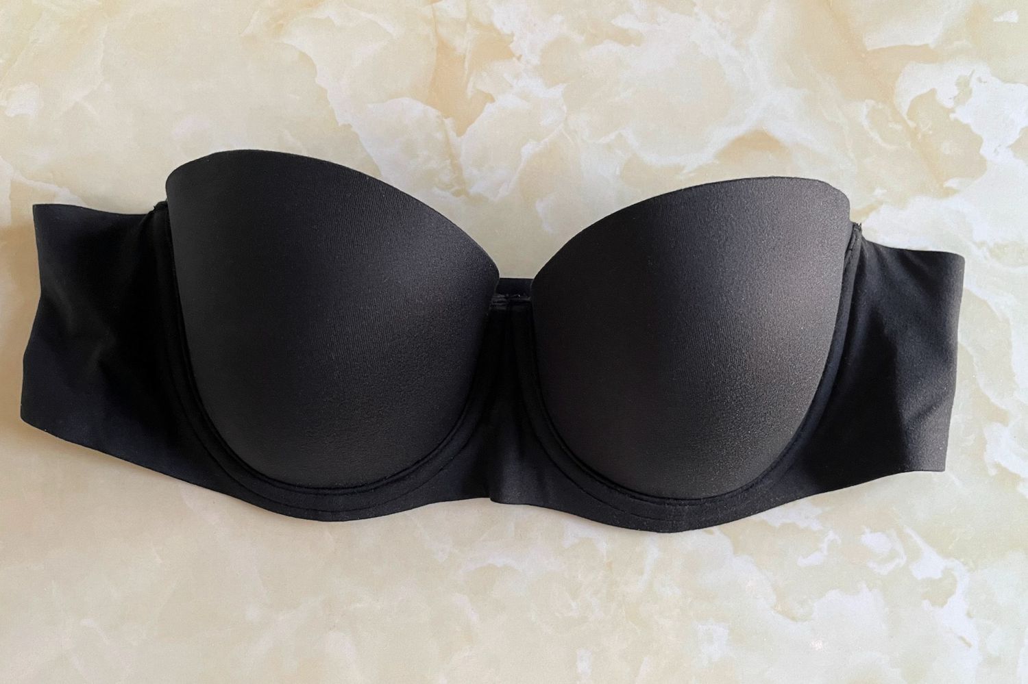 front of Aerie Real Sunnie Strapless Lightly Lined Bra on marble surface