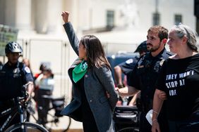 Representative Alexandria Ocasio-Cortez, a Democrat from New York, is arrested outside the US Supreme Court during a protest of the court overturning Roe v. Wade in Washington, D.C., US, on Tuesday, July 19, 2022. The high court's reversal of the 1973 landmark decision protecting the federal right to abortion has sent shock waves through the medical, legal and advocacy communities with the White House signing an executive order intended to preserve access to the procedure. Photographer: Al Drago/Bloomberg via Getty Images