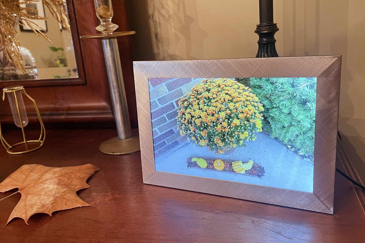 Polaroid Digital Photo Frame on a table displaying the outdoors on a table