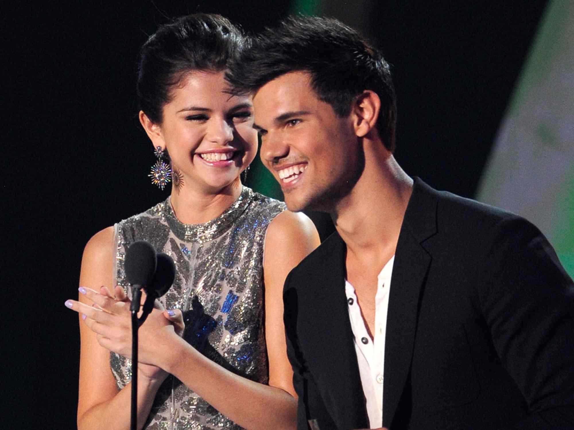 Selena Gomez and Taylor Lautner on stage at the The 28th Annual MTV Video Music Awards at Nokia Theatre L.A. LIVE on August 28, 2011 in Los Angeles, California