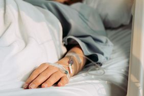 woman lying sick in hospital.