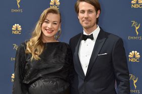 Yvonne Strahovski (L) and Tim Loden attend the 70th Emmy Awards