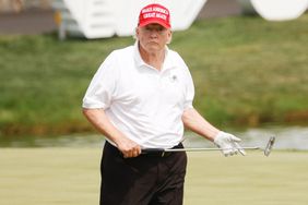 Former U.S. President Donald Trump looks on over the 18th green during the pro-am prior to the LIV Golf Invitational - Bedminster at Trump National Golf Club Bedminster on July 28, 2022 in Bedminster, New Jersey. 