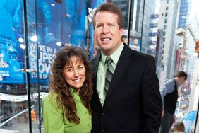 Jim Bob Duggar (R) and wife Michelle Duggar visit "Extra" at their New York studios at H&M in Times Square on March 11, 2014 in New York City.