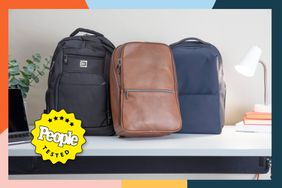 Three laptop backpacks for travel displayed on a white desk