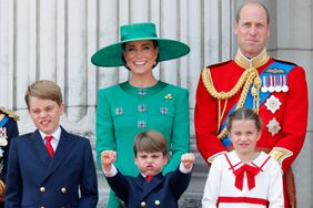Prince George of Wales, Prince Louis of Wales, Catherine, Princess of Wales, Princess Charlotte of Wales and Prince William, Prince of Wales watch an RAF flypast from the balcony of Buckingham Palace during Trooping the Colour