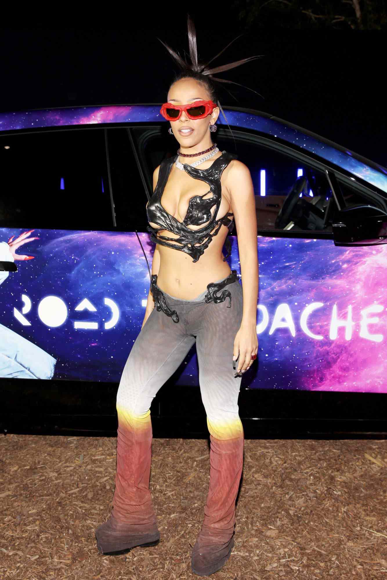 COACHELLA, CALIFORNIA - APRIL 15: (EDITORS NOTE: Image contains partial nudity.) Doja Cat attends the Swedish House Mafia “Paradise Again” Album Release Party with Spotify Live from the Desert at Zenyara on April 15, 2022 in Coachella, California. (Photo by Jesse Grant/Getty Images for Spotify)
