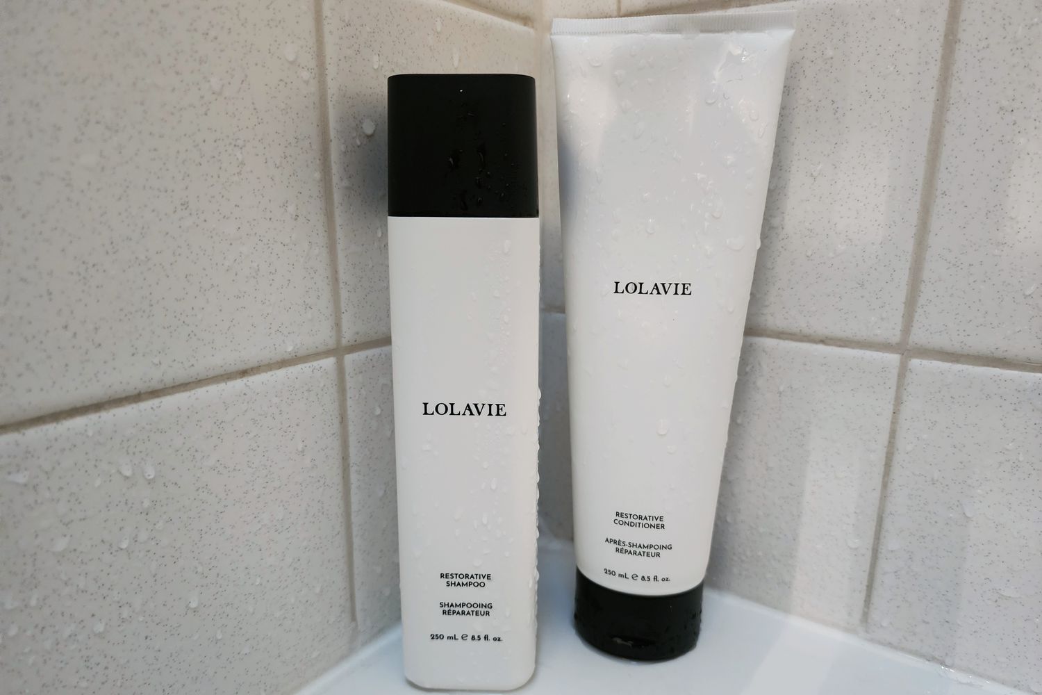 Bottles of LolaVie Restorative Shampoo and Conditioner