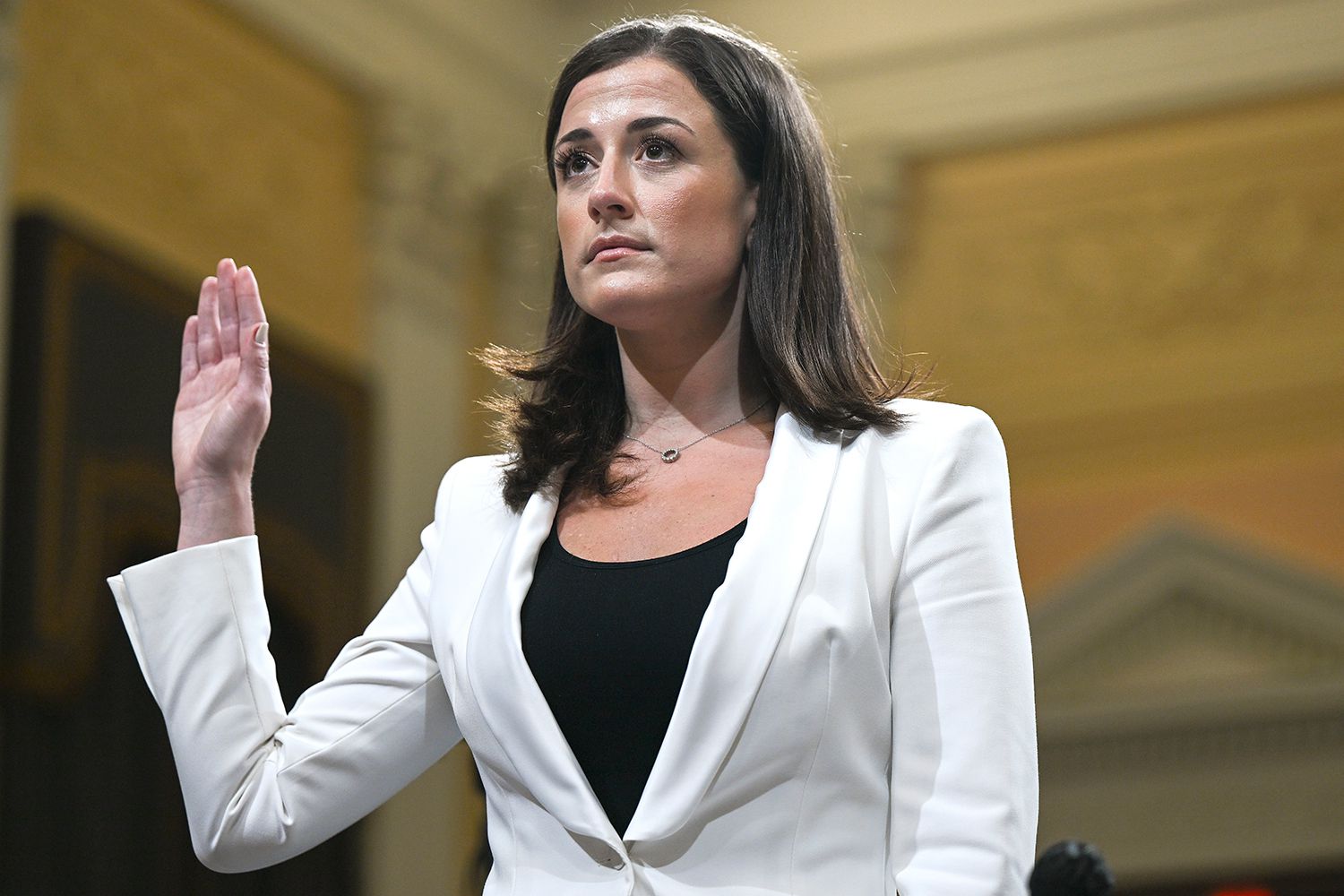 Cassidy Hutchinson, a top former aide to Trump White House Chief of Staff Mark Meadows, is sworn-in as she testifies during the sixth hearing by the House Select Committee on the January 6th insurrection in the Cannon House Office Building on June 28, 2022 in Washington, DC. The bipartisan committee, which has been gathering evidence for almost a year related to the January 6 attack at the U.S. Capitol, is presenting its findings in a series of televised hearings. On January 6, 2021, supporters of former President Donald Trump attacked the U.S. Capitol Building during an attempt to disrupt a congressional vote to confirm the electoral college win for President Joe Biden.