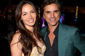 Caitlin McHugh and John Stamos at the World Premiere of 'The Little Mermaid' in Los Angeles, California on May 08, 2023. 
