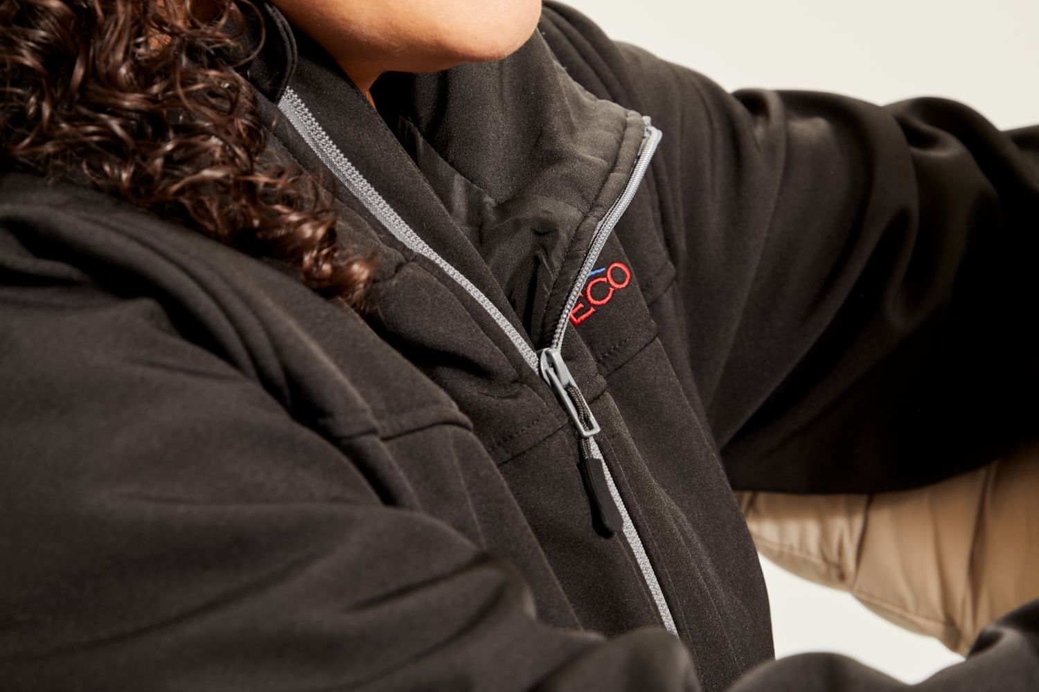 Closeup of zipper and collar of a Conqueco Women's Slim-fit Heated Jacket