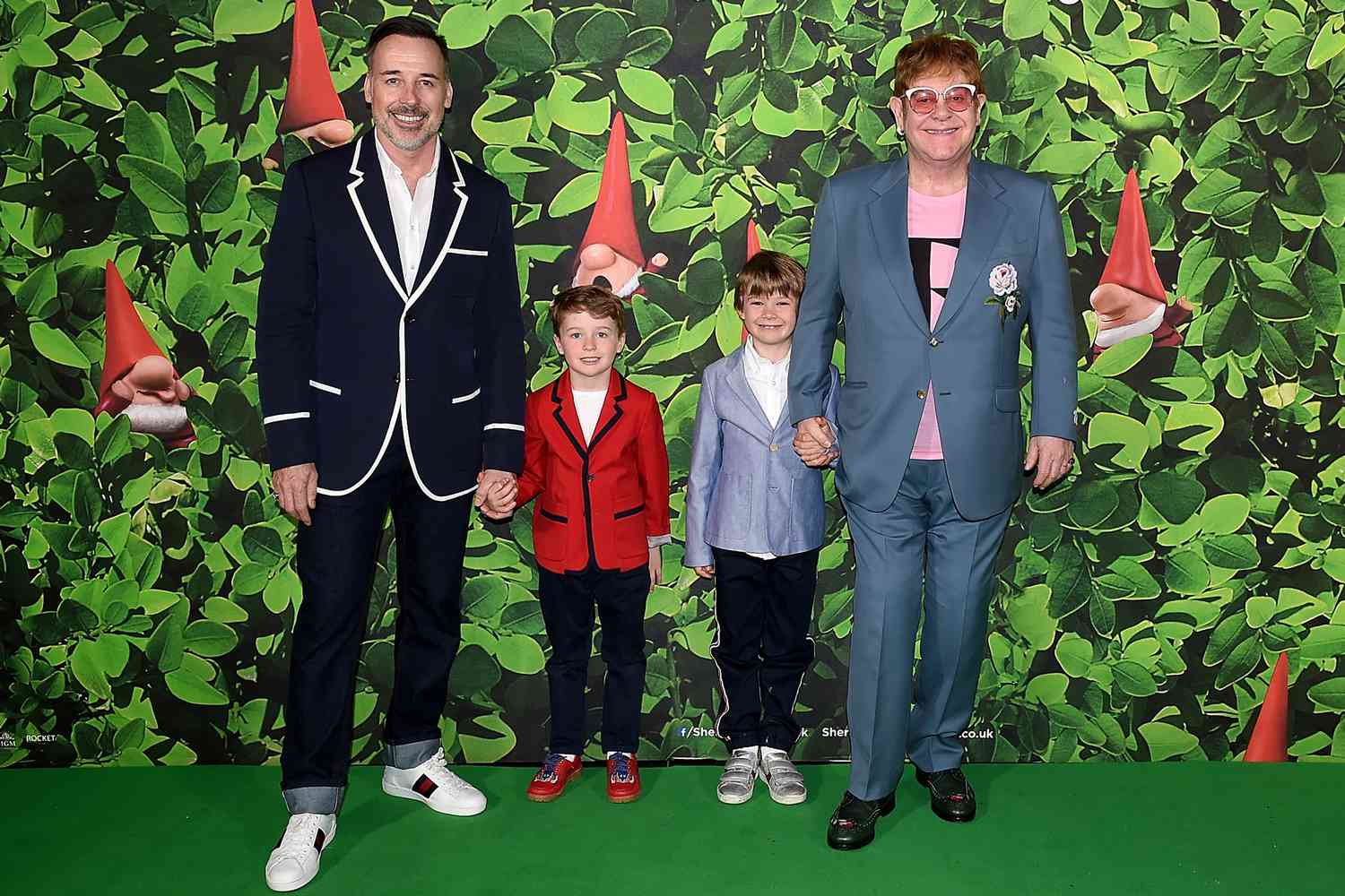 David Furnish (L) and Elton John with sons Elijah and Zachary attending the 'Sherlock Gnomes' London Family Gala hosted by Sir Elton John and David Furnish at Cineworld Leicester Square on April 22, 2018