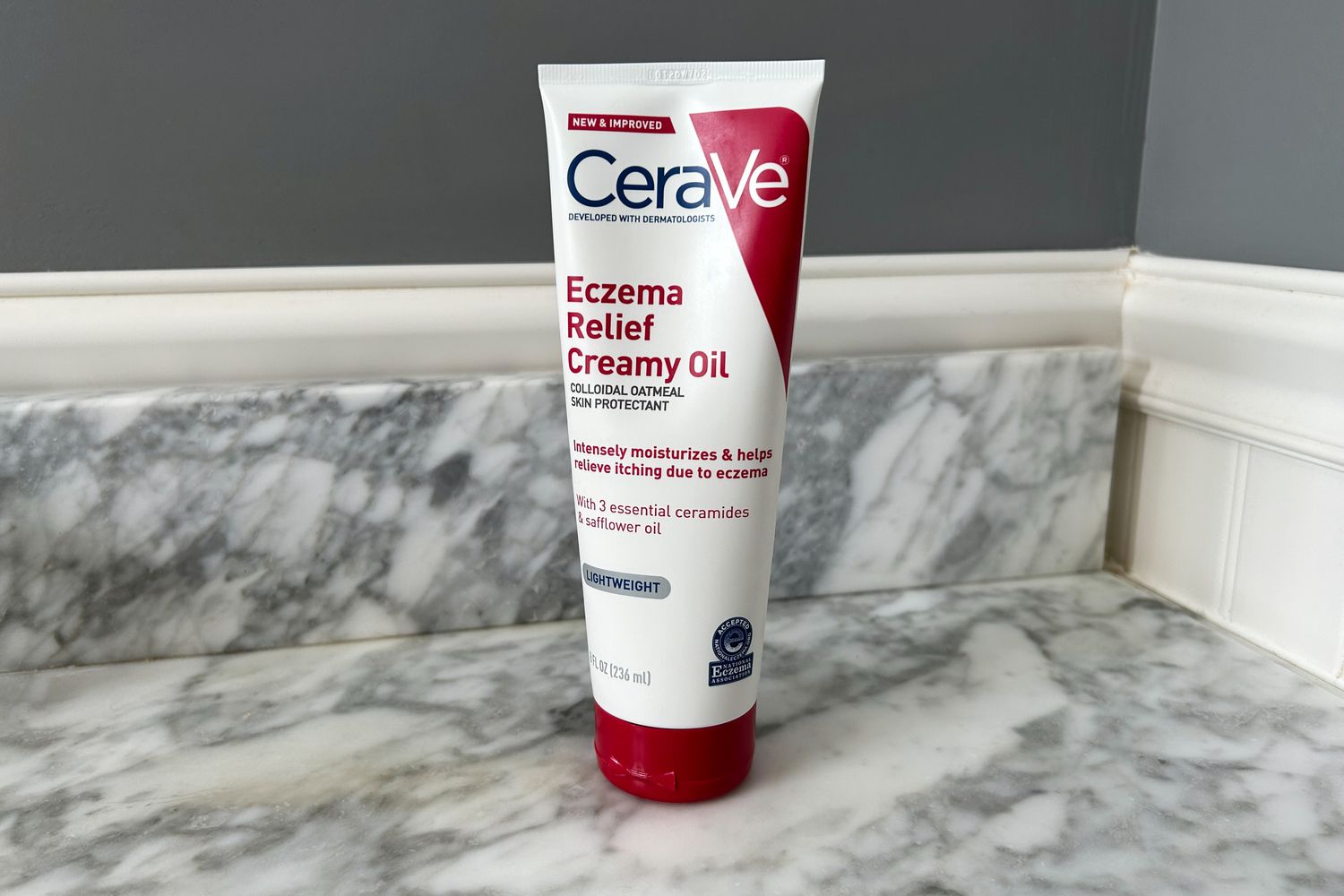 CeraVe Eczema Relief Creamy Oil displayed on a marble bathroom counter