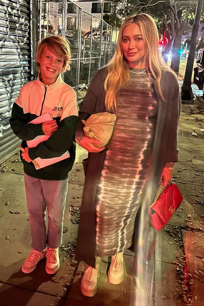 Hilary Duff with a pink bag and her son 
