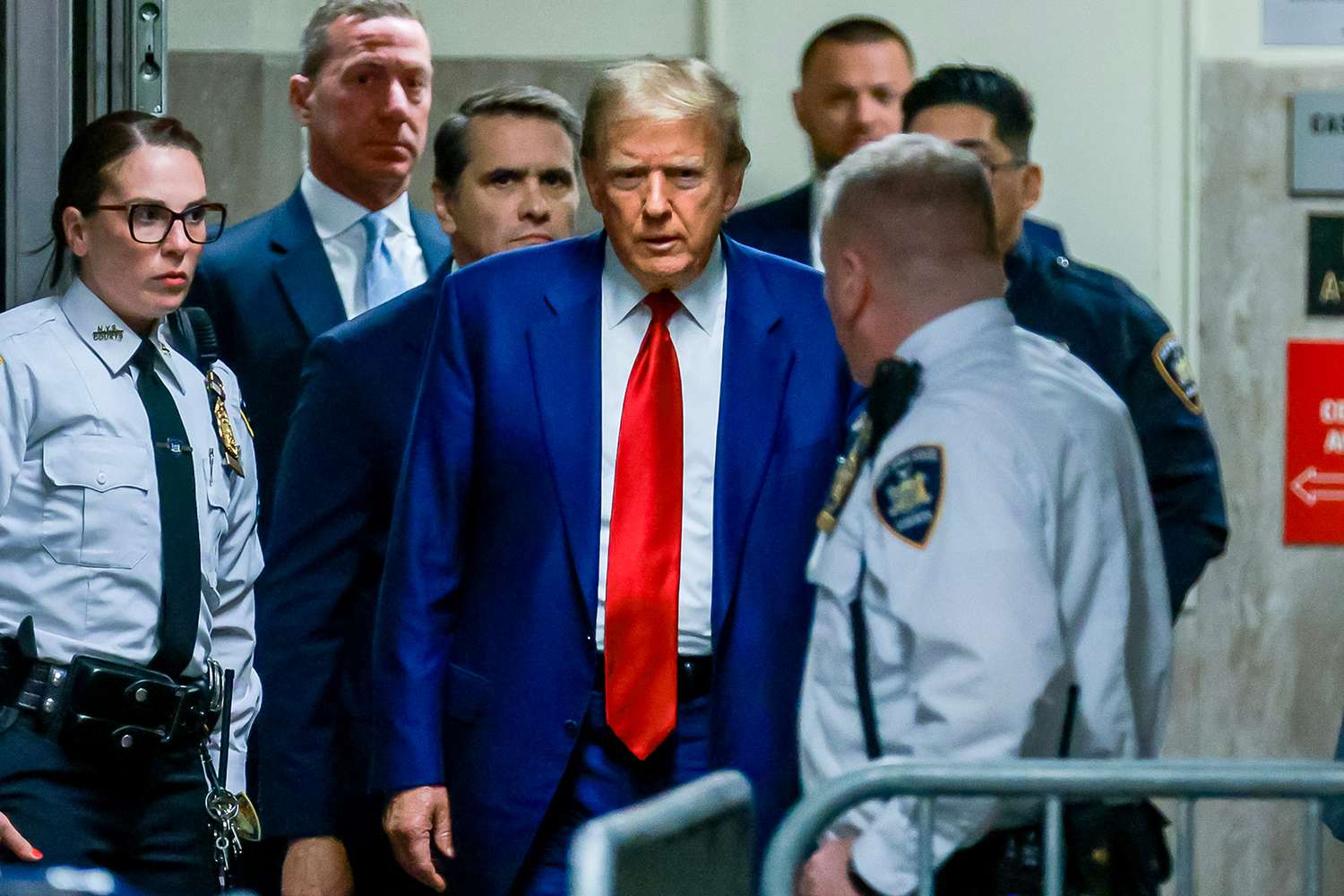 Former US President Donald Trump arrives for his hearing to determine the date of his trial for allegedly covering up hush money payments linked to extramarital affairs, at Manhattan Criminal Court in New York City on March 25, 2024.