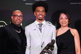 Jayden Daniels with his parents after winning the Heisman Trophy on December 9, 2023 in New York City, New York. 