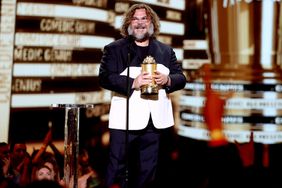 SANTA MONICA, CALIFORNIA - JUNE 05: Honoree Jack Black accepts the Comedic Genius Award onstage during the 2022 MTV Movie & TV Awards at Barker Hangar on June 05, 2022 in Santa Monica, California. (Photo by Rich Polk/Getty Images for MTV)