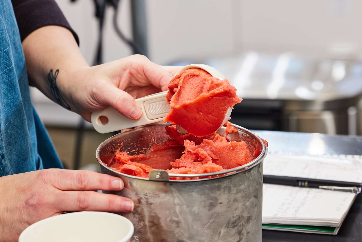 A person scooping sorbet out of the VEVOR Ice Cream Maker