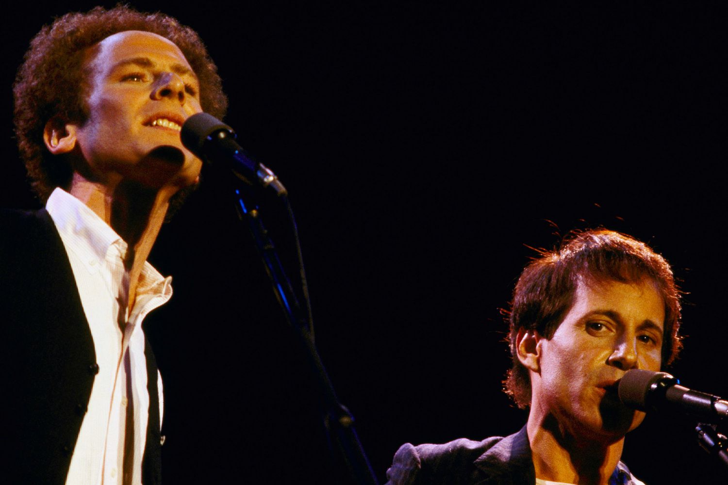 Art Garfunkel, left (wearing vest) and Paul Simon serenade an audience estimated close to one-half million in New York's Central Park