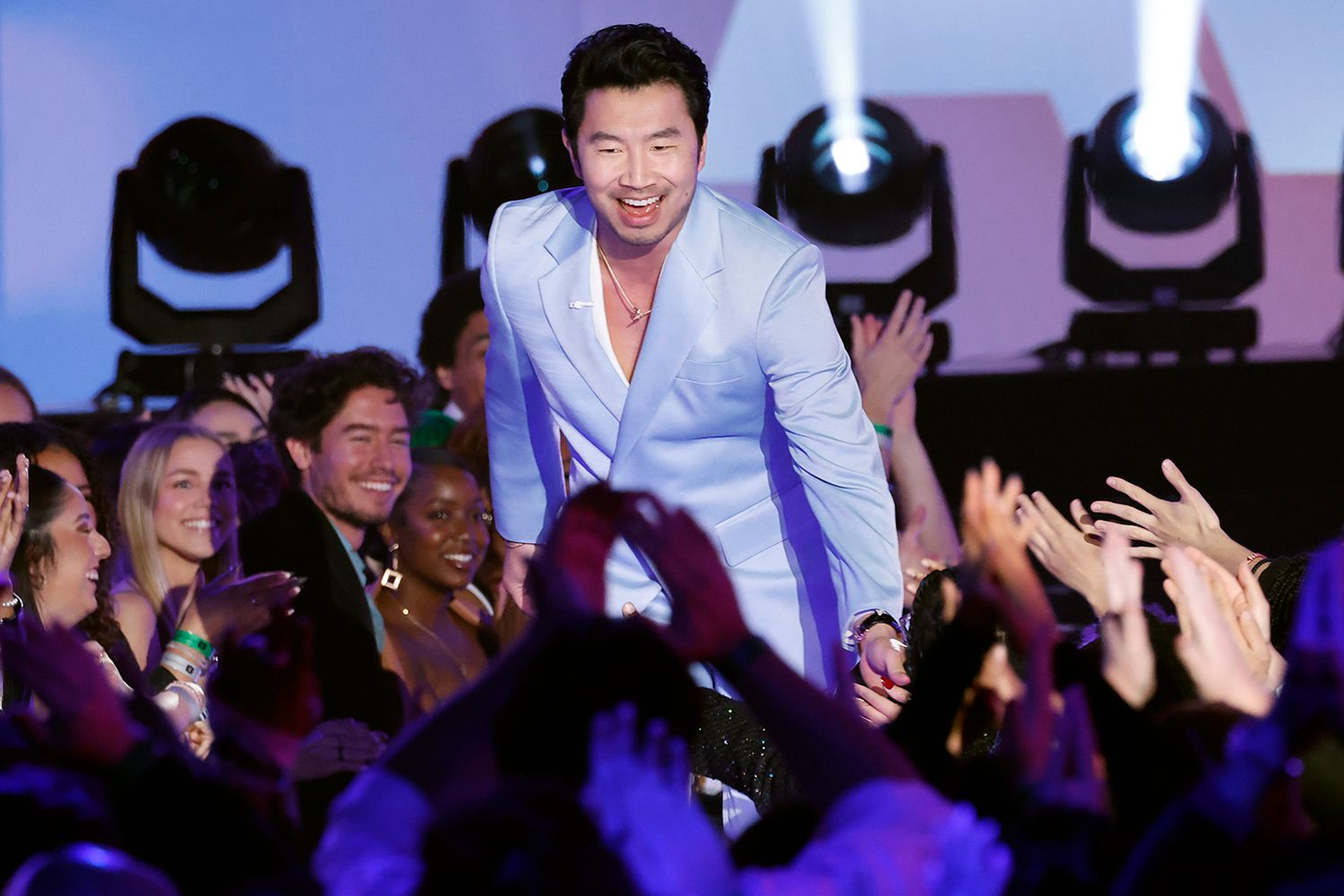Host Simu Liu speaks onstage during the 2024 People's Choice Awards held at Barker Hangar on February 18, 2024 in Santa Monica, California.