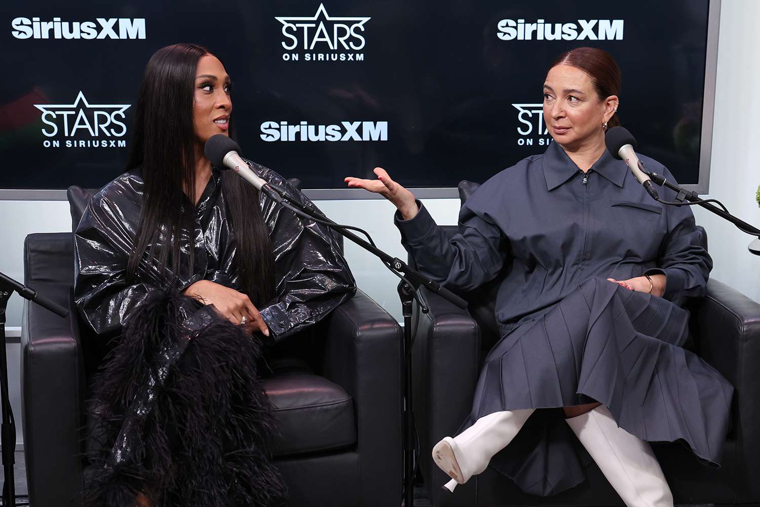 Michaela Jae Rodriguez and Maya Rudolph speak during SiriusXM's Town Hall with the cast of 'Loot' at SiriusXM Studio on March 27, 2024 in New York City.