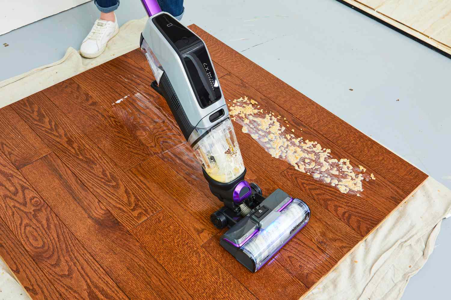 Testing vacuum on wooden floor