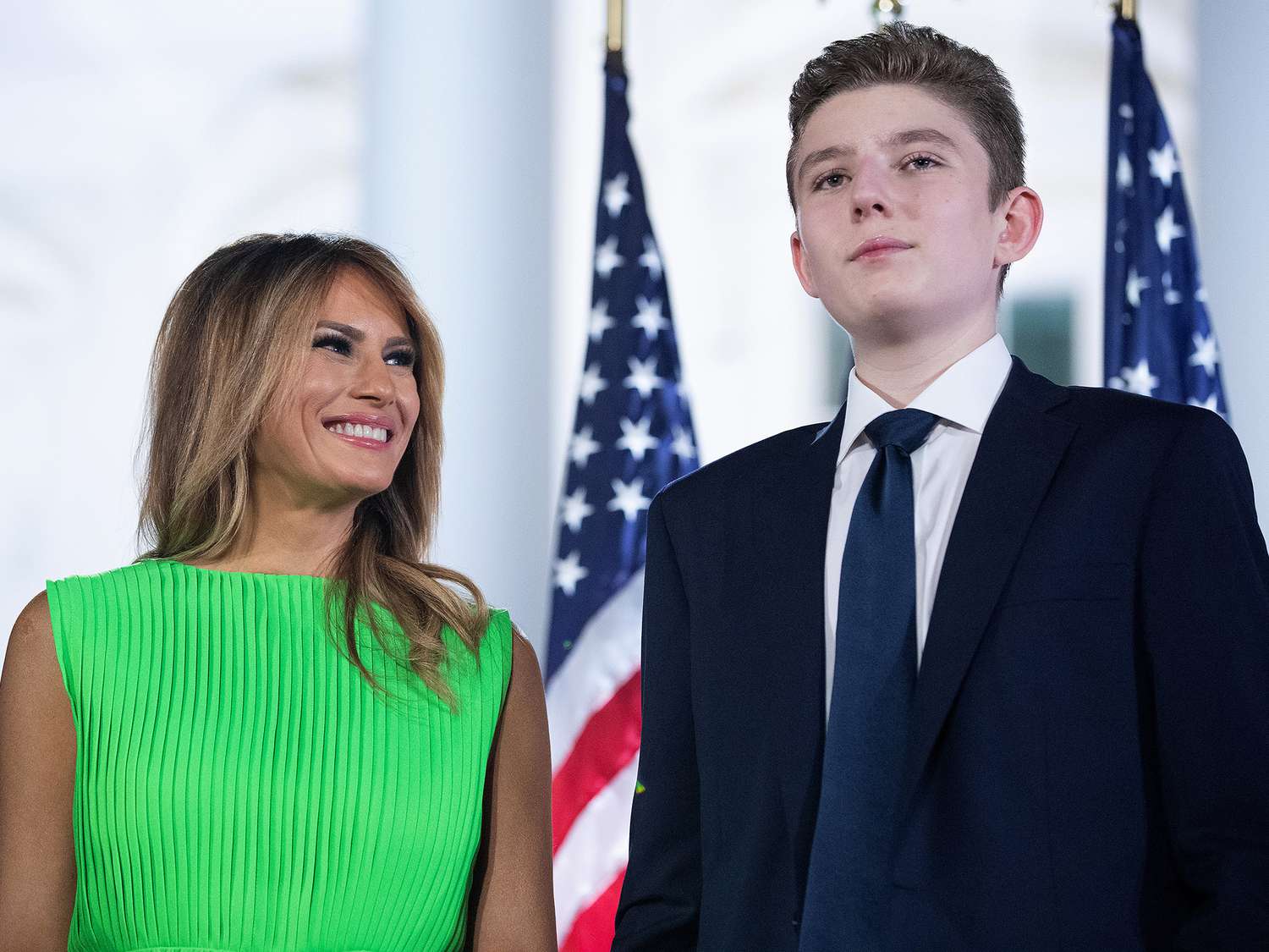 Melania Trump (L) looks at her son Barron Trump after U.S. President Donald Trump