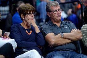 UCONN Head Coach Gene Auriemma and wife Kathy observe the action during the game as the Connecticut Sun host the Seattle Storm on August 08, 2017