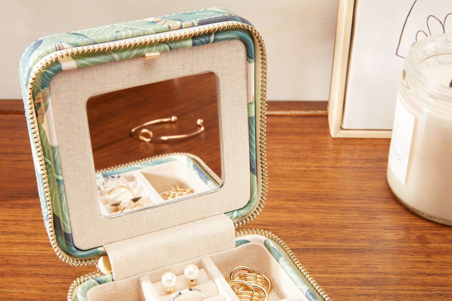 Close-up of the Mark & Graham Small Travel Jewelry Case's inside mirror. 