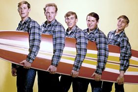 "The Beach Boys" with a surfboard in August 1962 in Los Angeles, California