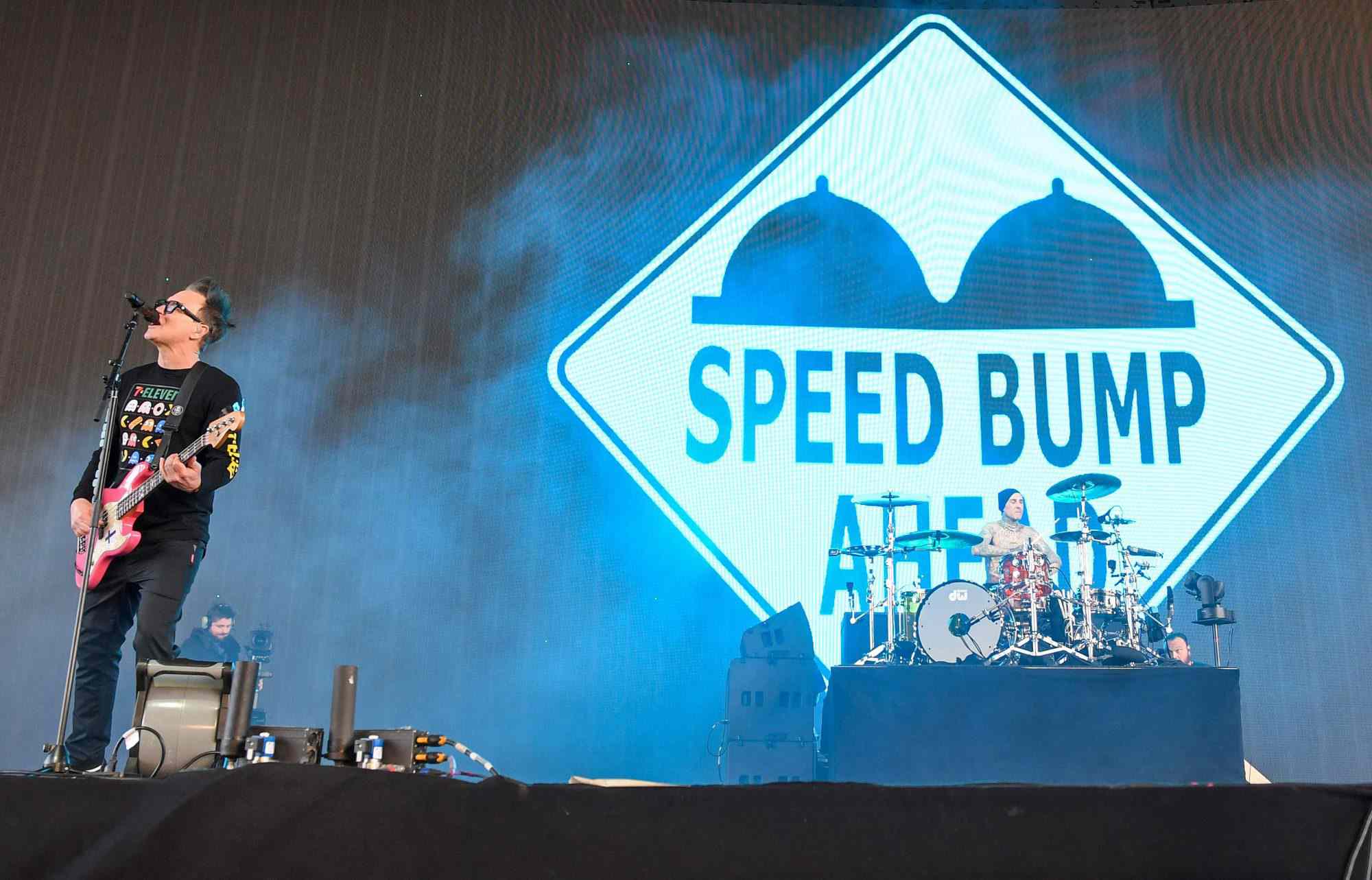 Blink-182 band members Mark Hoppus (L) and Travis Barker (R) perform during the first week-end of Coachella Valley Music and Arts Festival in Indio, California, on April 14, 2023. (Photo by VALERIE MACON / AFP) (Photo by VALERIE MACON/AFP via Getty Images)