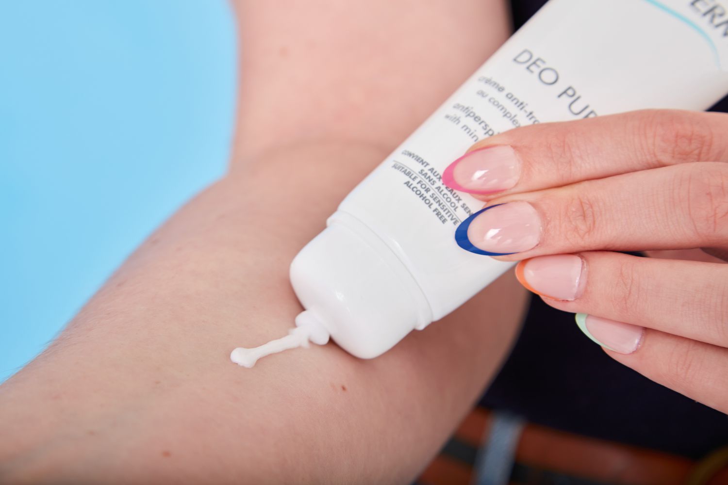 Hand applying Biotherm Deo Pure Antiperspirant Cream to forearm