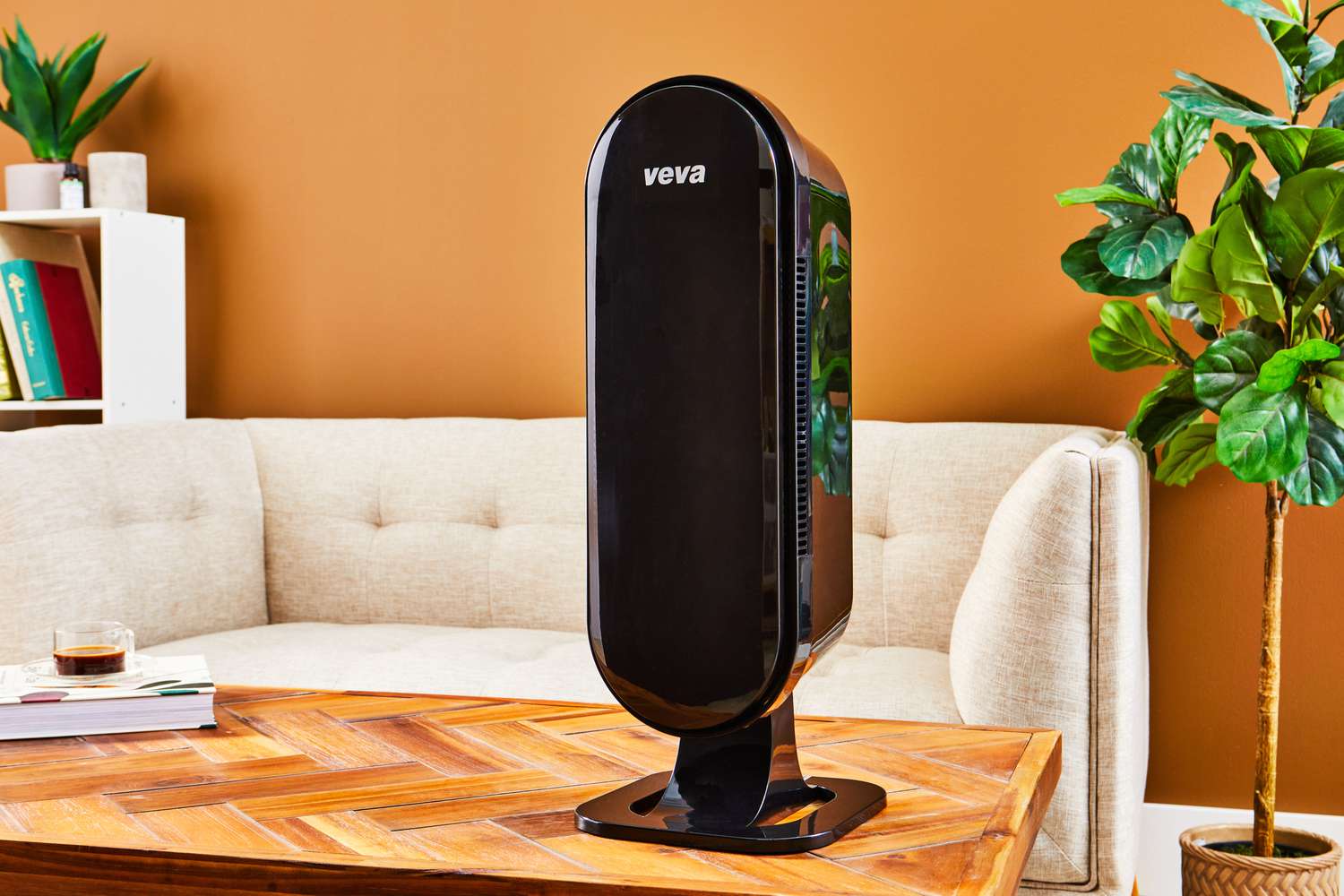 The VEVA 8000 Black Air Purifier on a wooden table