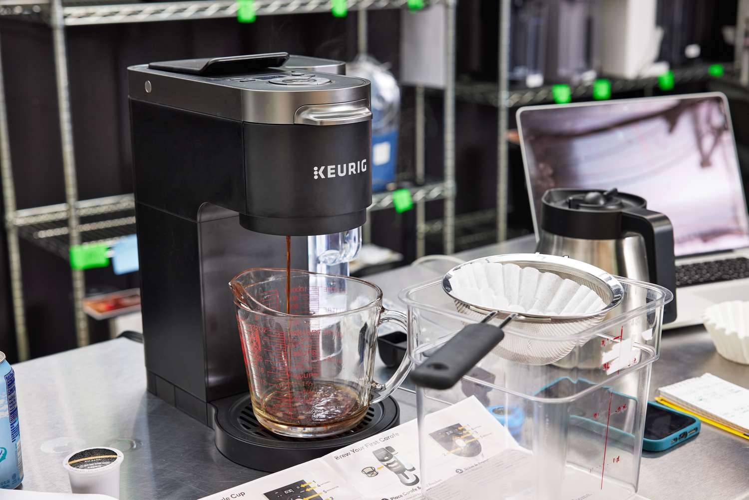 Keurig K-Duo Coffee Maker pouring coffee into a measuring cup
