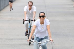 Jennifer Connelly and Paul Bettany are spotted on a bike ride in New York City. Jennifer, 52, wore a white t-shirt, jeans, and white trainers. The 52 year old English actor wore a henley shirt, light trousers, and Dr Martens shoes.