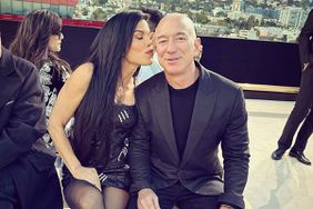 Jeff Bezos and Partner Lauren Sánchez Share a Kiss at Versace Fashion Show