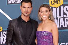 Taylor Lautner and Taylor Dome attend the 2022 CMT Music Awards at Nashville Municipal Auditorium on April 11, 2022 in Nashville, Tennessee