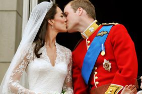 Prince William, Duke of Cambridge and Catherine, Duchess of Cambridge kiss on the balcony of Buckingham Palace after getting married on April 29, 2011