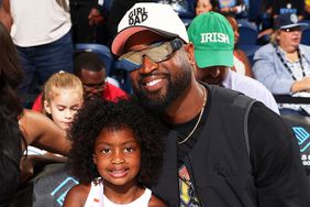 Dwyane Wade and daughter Kaavia attends the game between the Connecticut Sun and Chicago Sky on May 25, 2024 at the Wintrust Arena in Chicago, IL.