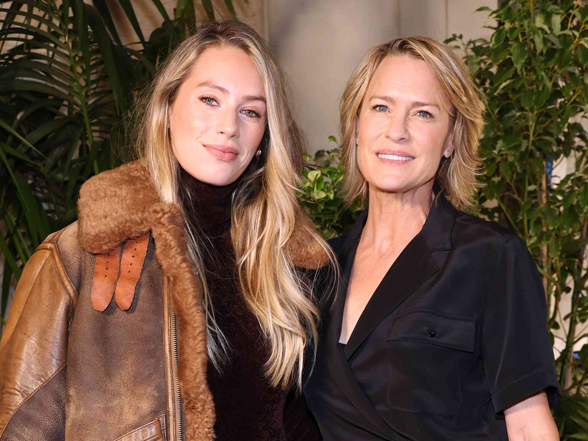 Dylan Penn and Robin Wright attend the Ralph Lauren SS23 Runway Show at The Huntington Library, Art Collections, and Botanical Gardens on October 13, 2022 in San Marino, California