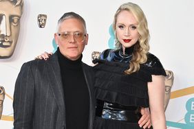 Giles Deacon and Gwendoline Christie arrive at the EE BAFTA Film Awards 2023 on February 19, 2023 in London, England. 
