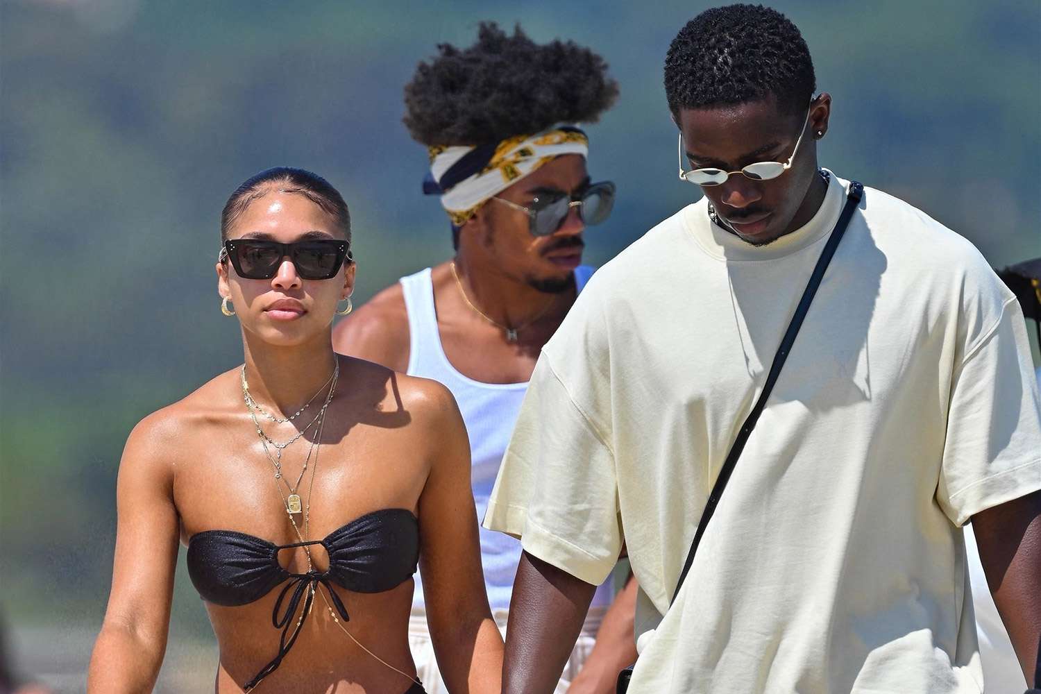 Damson Idris and his partner Lori Harvey walk hand in hand while arriving in style at the Shellona restaurant in Saint-Tropez in the French Riviera