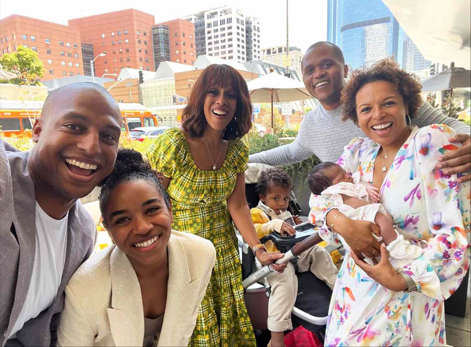 Gayle King (center) and her family pose with her newborn granddaughter Grayson