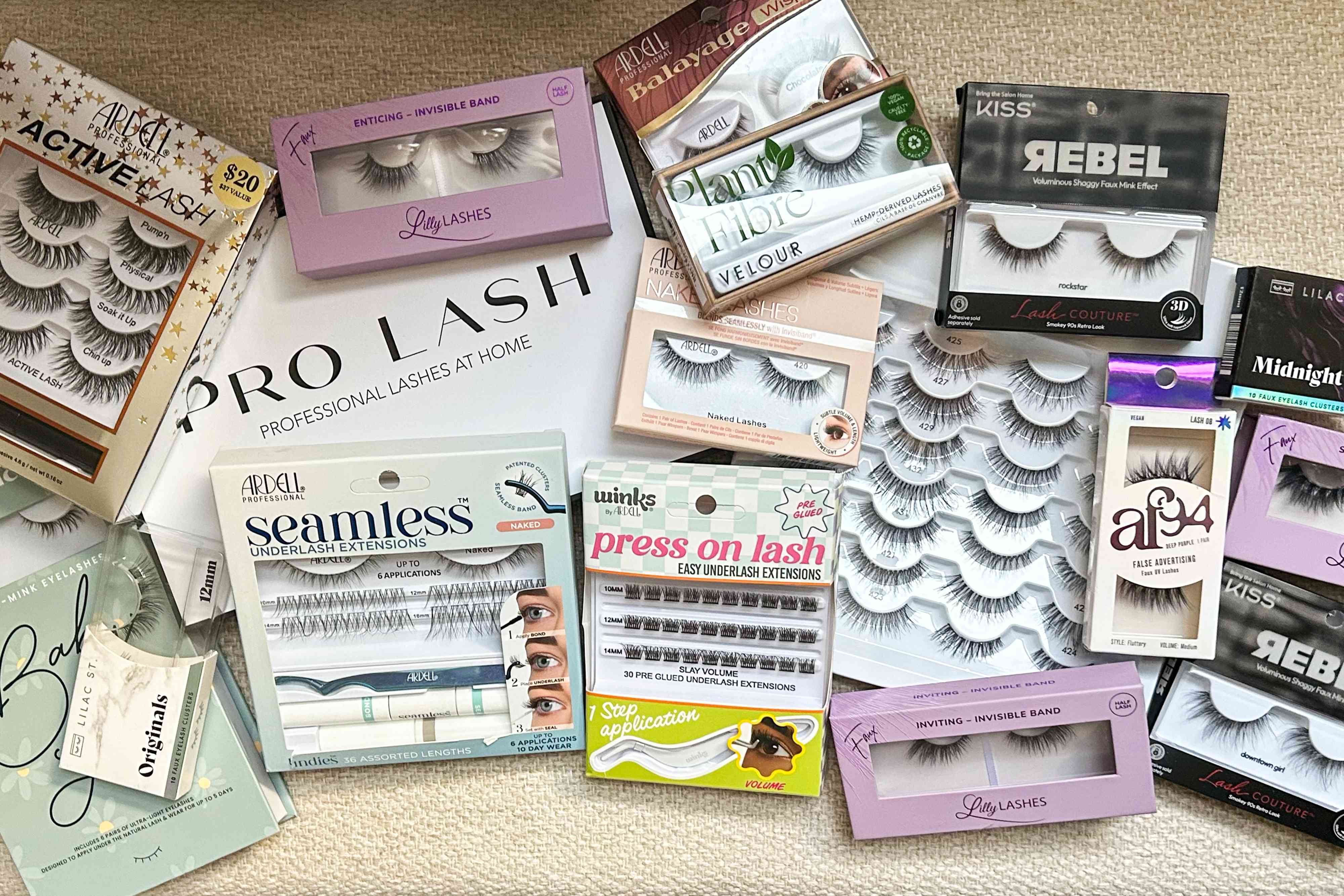 An assorted of false eyelashes we recommend on a patterned flat surface
