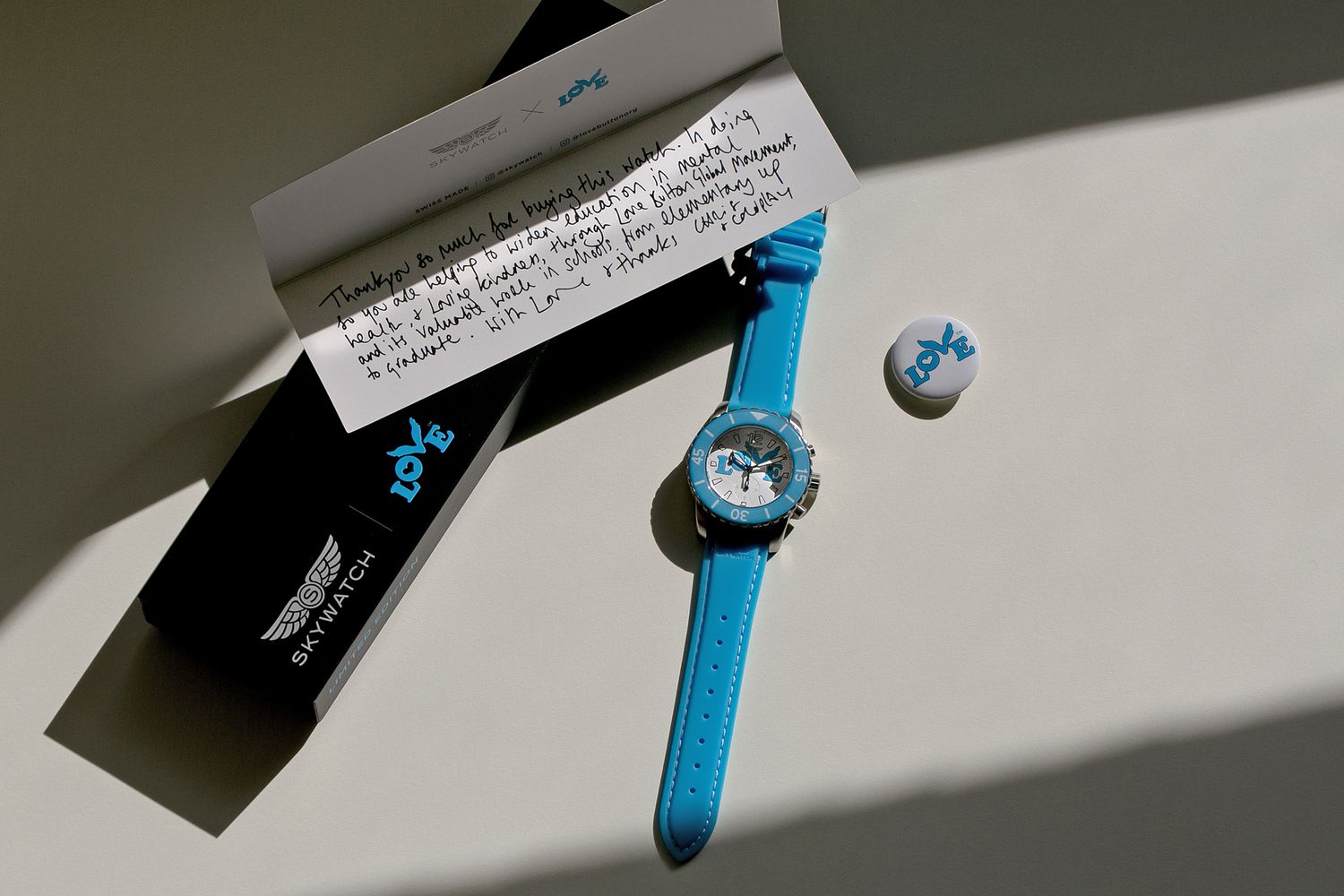 Coldplay’s Chris Martin Co-designs Limited Edition Skywatch X Love Button Watch Benefitting Love Button Global Movement