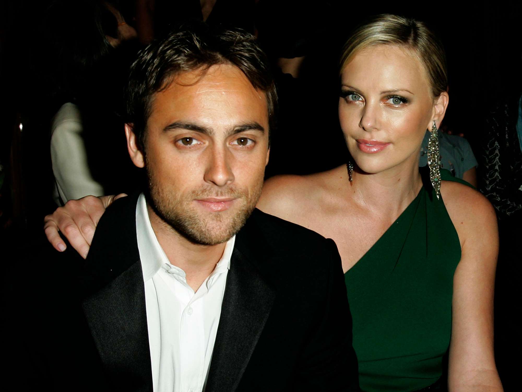 Stuart Townsend and Charlize Theron during Gucci Spring 2006 Fashion Show to Benefit Children's Action Network and Westside Children's Center - Inside at Private Residence in Beverly Hills, California, United States