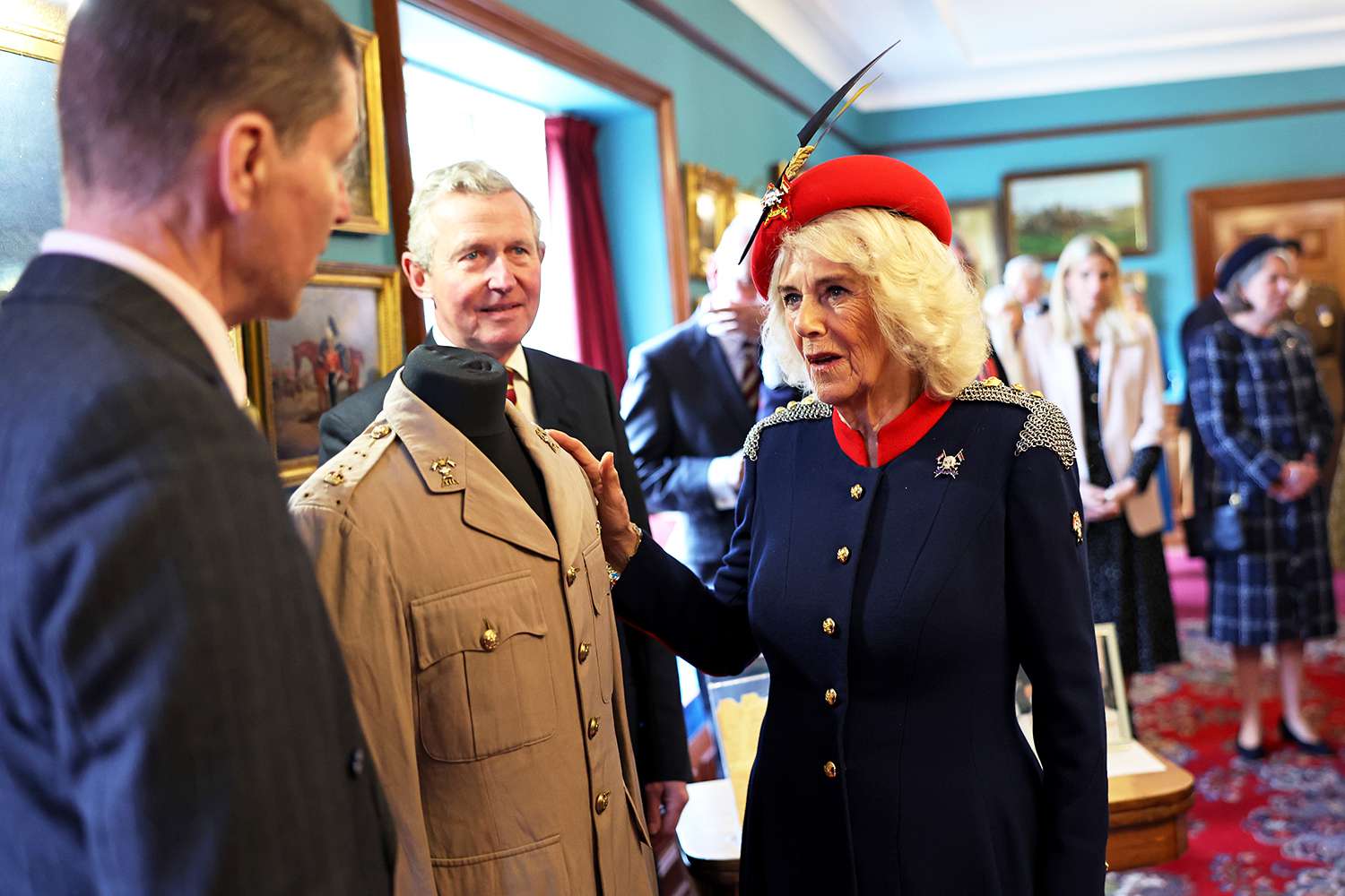 Queen Camilla views the tunic belonging to her late father Major Bruce Shand MC & Bar who served in The Royal Lancers during WW2 during a visit to The Royal Lancers on April 22, 2024 in Catterick, England.